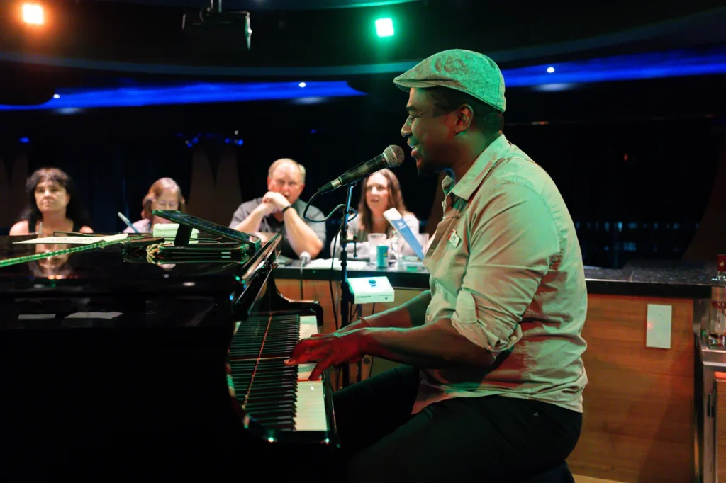 Josh Mille serenading Carnival Magic cruisers in the Piano Bar