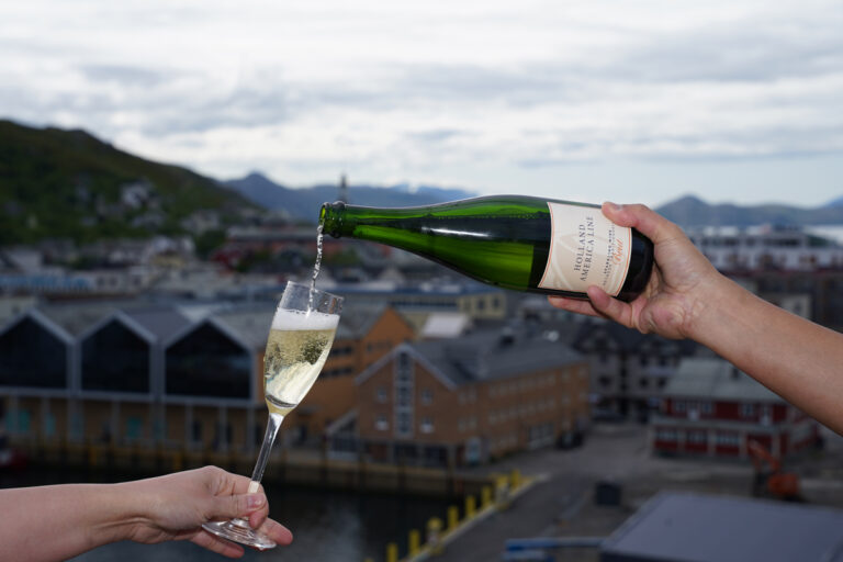 Glass of Holland America's exclusive sparkling wine served onboard a cruise ship