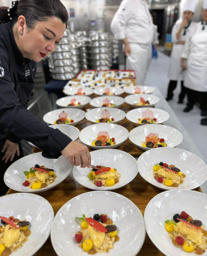 Koningstafel's Fleet Manager, Pamela Sta Ana making sure the plates are perfect for guests