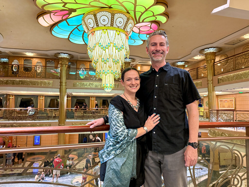 Cruise couple Mikkel and Dan Woodruff dresses for dinner aboard Disney Fantasy. Photo courtesy of SometimesSailing.com.