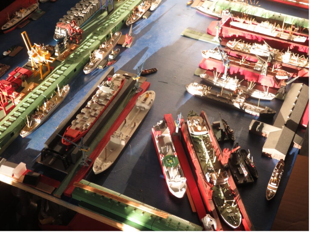 William H. Miller's model ocean liners and cruise ships in a miniature New York harbor.