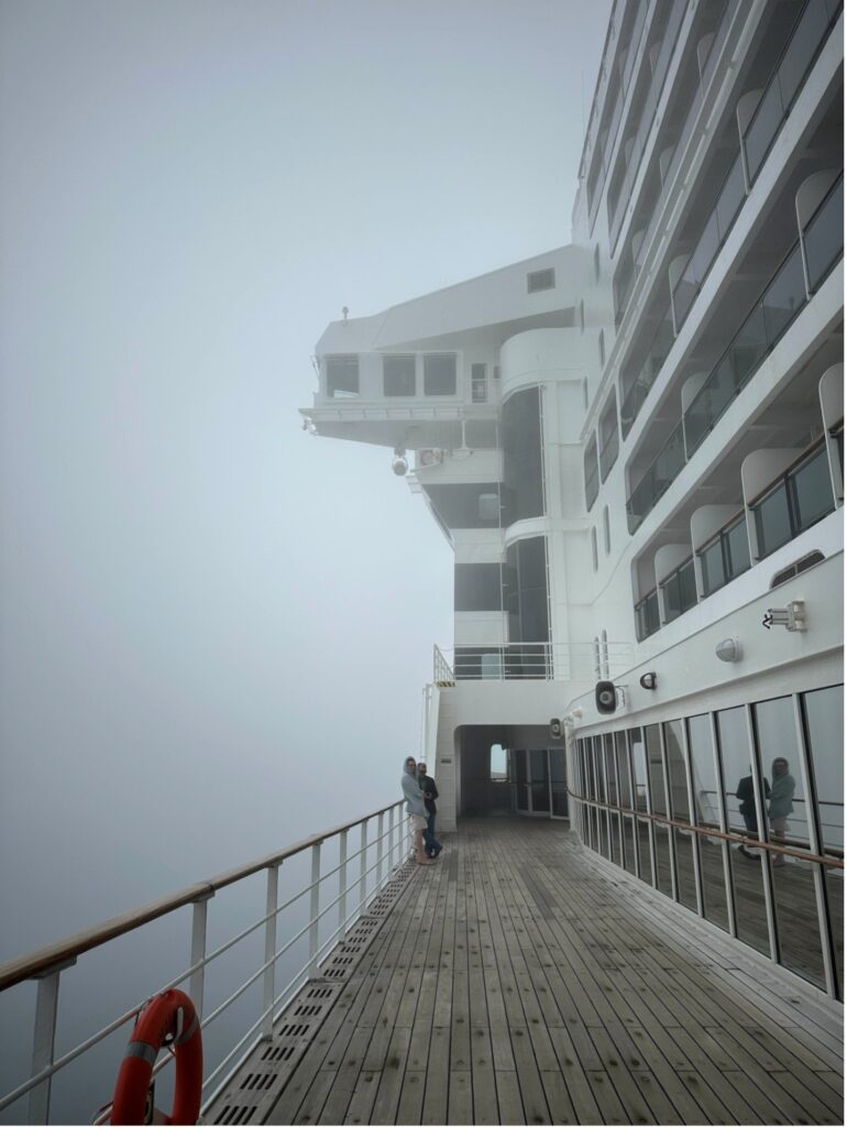 Port-side promenade aboard Queen Mary 2 on a foggy June morning. Photo credit: Rebecca Klein.