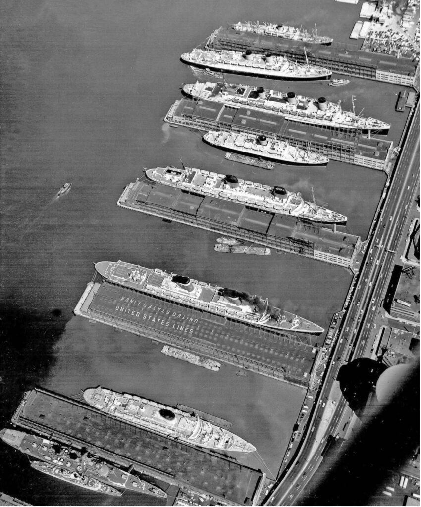 "Luxury Liner Row" on an April morning in 1959: the Media (top), Mauretania (departing), Queen Mary, Ivernia, Liberte, United States and Giulio Cesare. From the William H. Miller. collection.