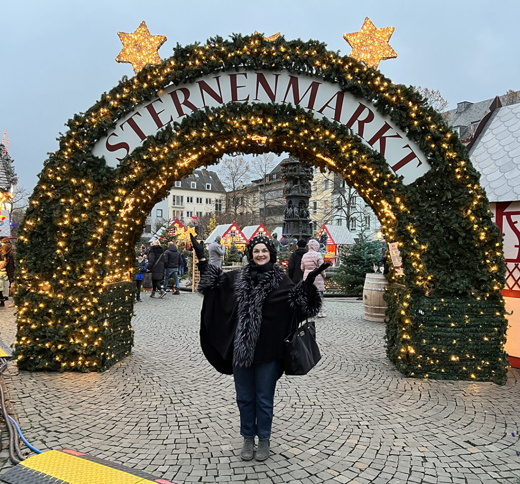 World's Greatest Cruises' Lynn Elmhirst welcomes guests to the Koblenz, Germany, Christmas market. Photo courtesy of World's Greatest Cruises.