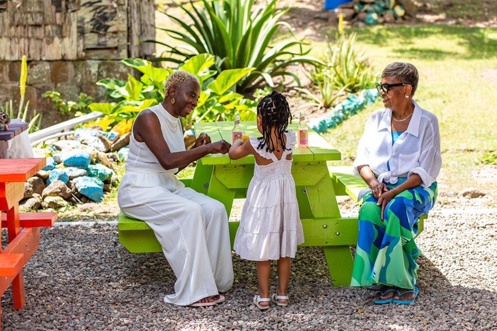 Authentic cultural experiences come alive on the island of Nevis, where generations connect over local traditions, vibrant flavors, and warm Caribbean hospitality. Image courtesy of Greg Phllip.