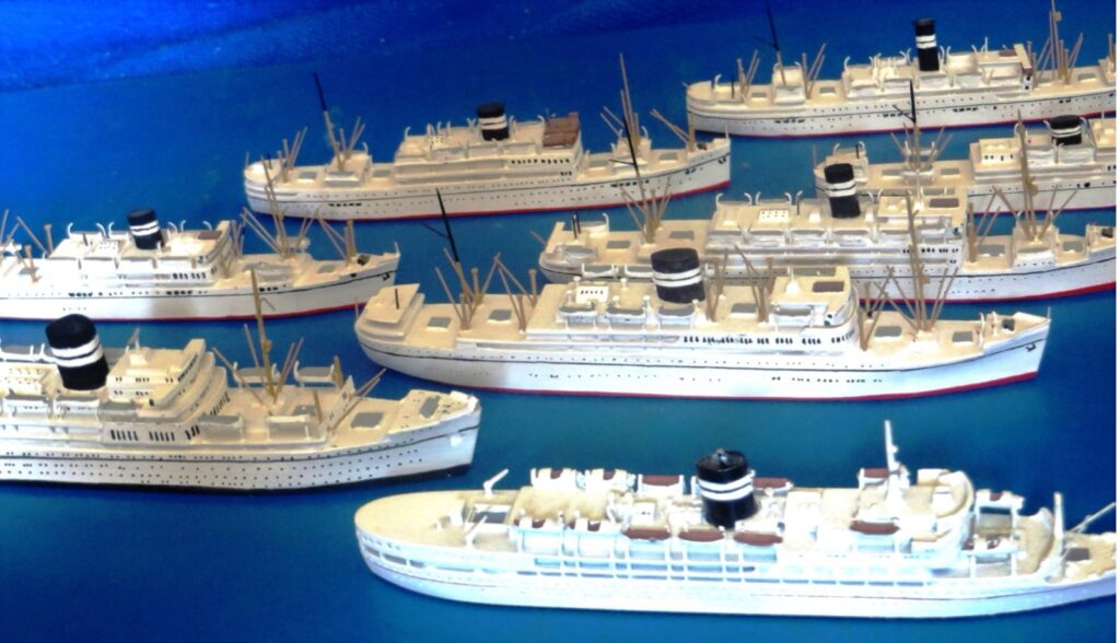 Postwar models of the British India Steam Navigation Company fleet, displayed from the William H. Miller collection.