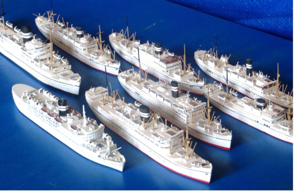 Postwar models of the British India Steam Navigation Company fleet, displayed from the William H. Miller collection.
