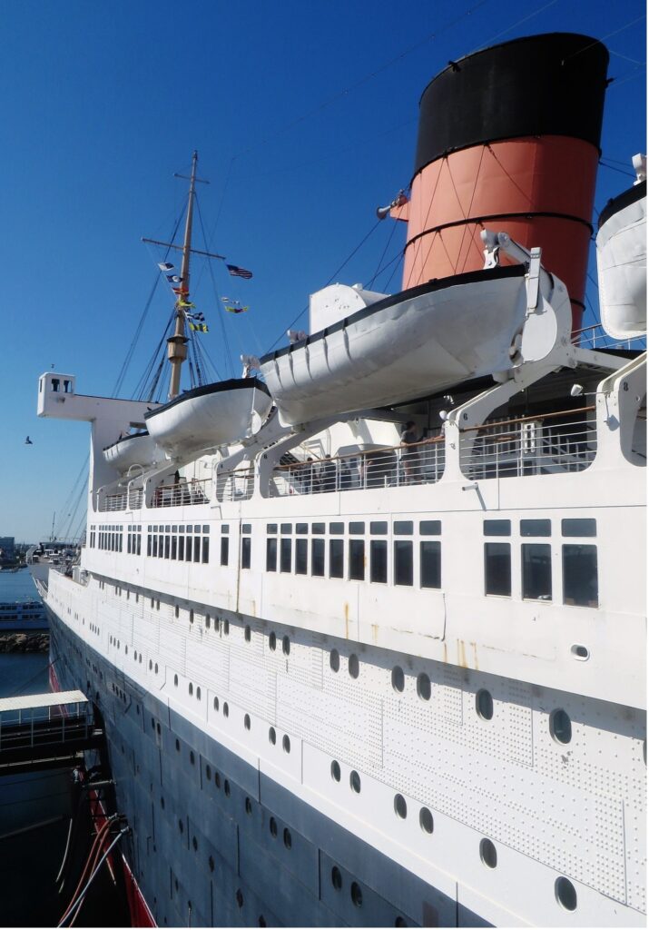 The preserved ocean liner RMS Queen Mary, permanently moored in Long Beach, California. From the William Miller collection.