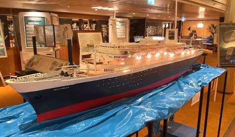A detailed model of SS Rotterdam displays Holland America Line’s signature dark-blue hull and white superstructure from its postwar era. Photo credit: Jan Willem Goudriaan.