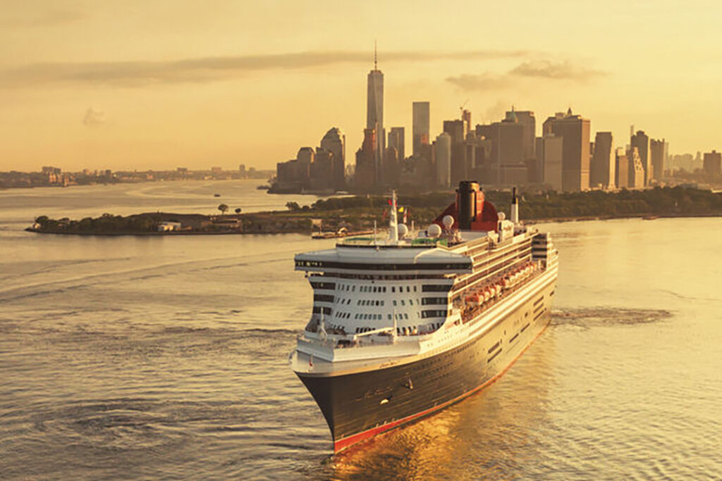 Queen Mary 2 is framed by the Manhattan morning skyline. Image courtesy of Cunard Lines.