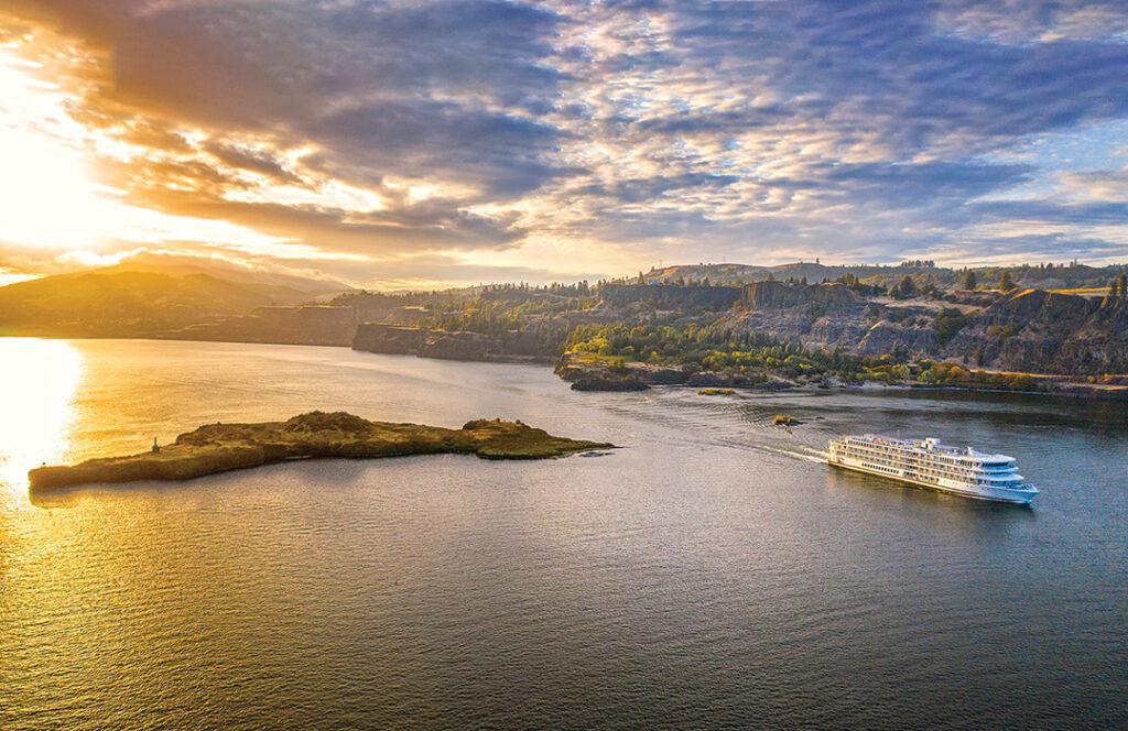 American Cruise Lines’ modern riverboat American Harmony sails through the Columbia River Gorge near Hood River, Oregon. Image courtesy of American Cruise Lines.