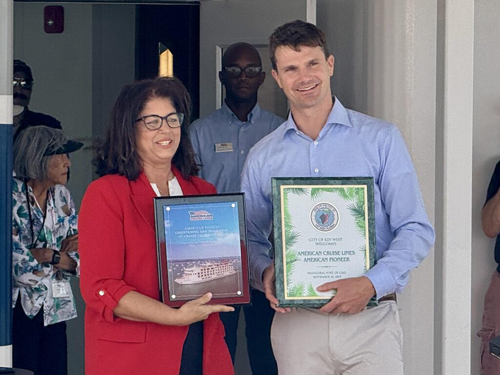 Key West Mayor Danise “Dee Dee” Henriquez and American Cruise Lines President and CEO Charles B. Robertson exchange plaques during a traditional “plaques and keys” ceremony marking the American Pioneer’s maiden call at Mallory Square on November 10, 2025. Photo credit: CruiseNews.