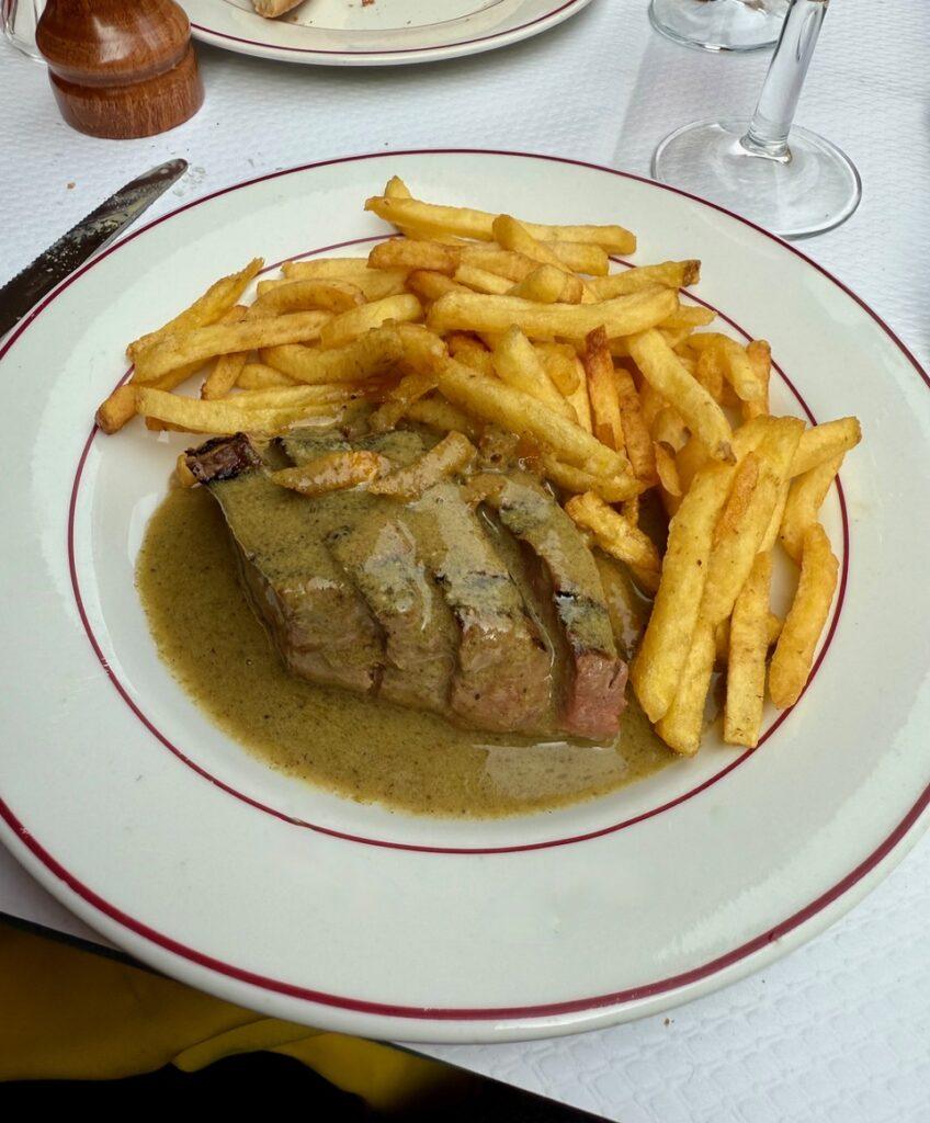 L’entrecote’s Steak and Famous Sauce. Credit: Monte Mathews.
