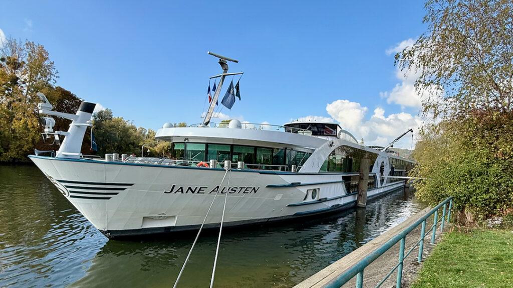 Riviera’s Jane Austen at dock, her reflection as serene as the river she sails. Photo Credit: Monte Mathews.