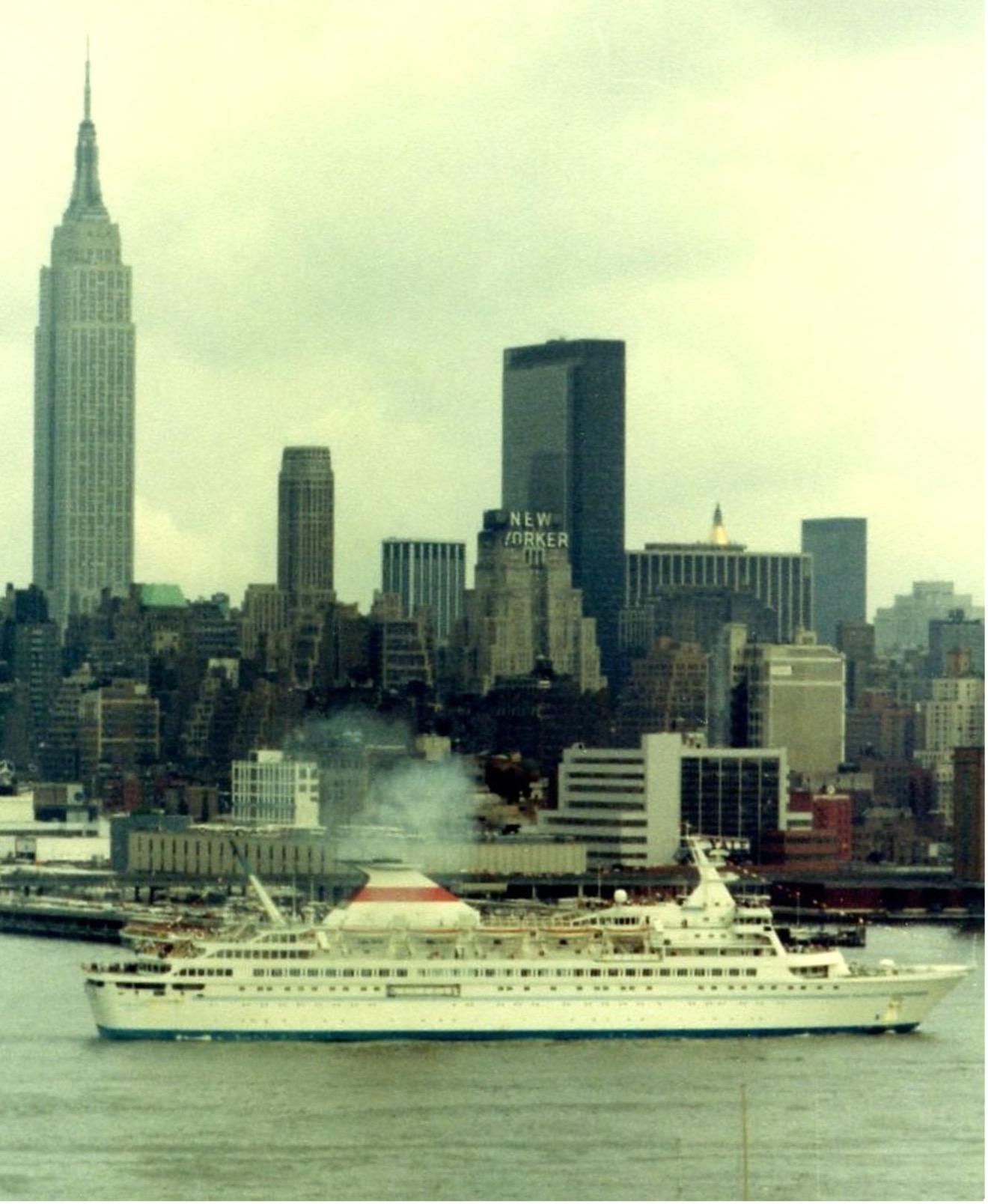 The Soviet cruise ship Kazakhstan sails from New York in 1977, later passing through several owners before being sold for scrap in 2012. From the William H. Miller collection.