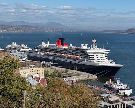 Queen Mary 2 and Viking Mars meet in Quebec City in October 2025. From the William H. Miller collection.