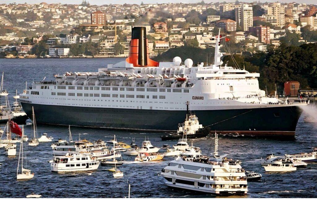 The Cunard liner Queen Mary 2 makes a grand entrance into Sydney Harbour in 2008. From the William H. Miller collection.