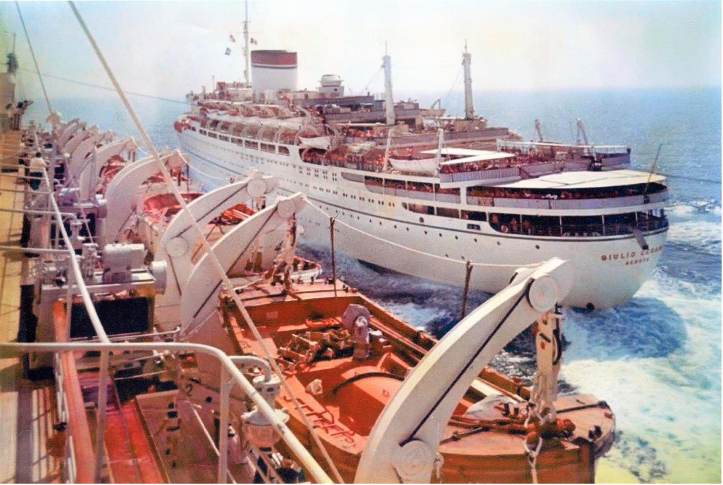 The Italian liner Augustus passing her sister-ship Giulio Cesare in the mid-Atlantic. From the William H. Miller Collection.
