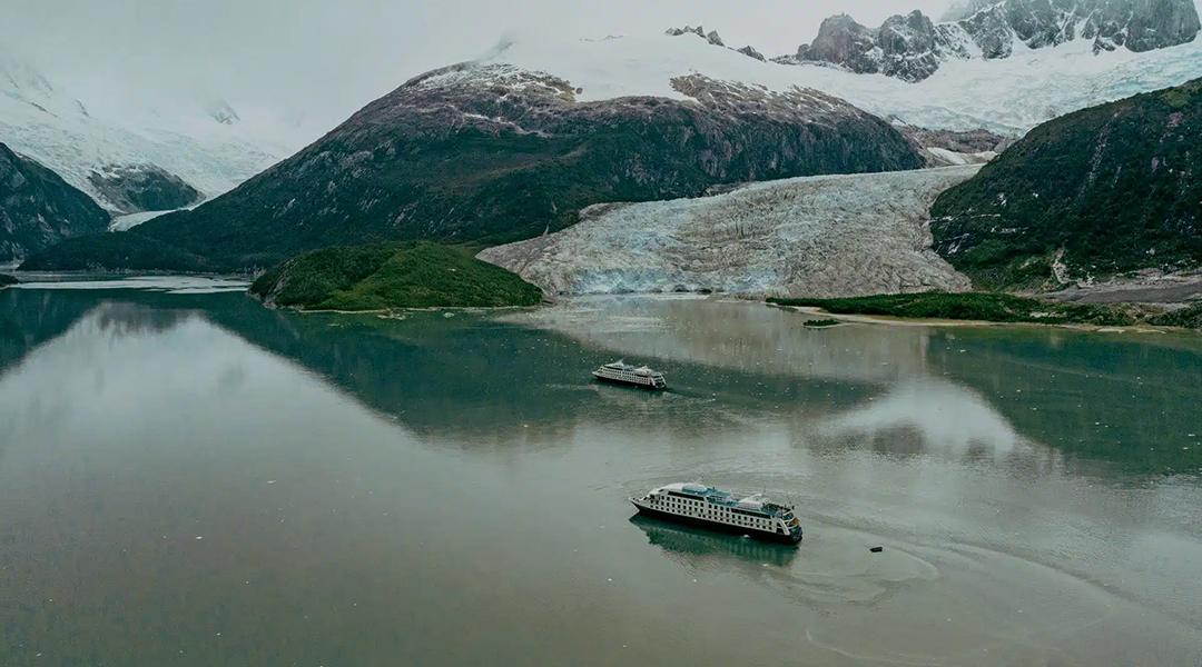 Two Australis expedition ships glide through Patagonia’s glacial waterways. Credit: Australis Cruises