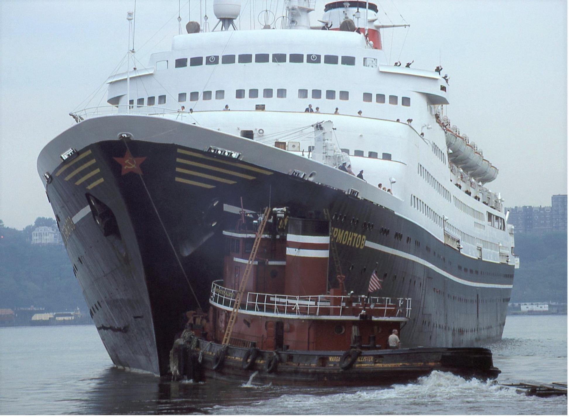 The Soviet passenger liner Mikhail Lermontov maneuvering with tug assistance in New York Harbor. William H. Miller Collection