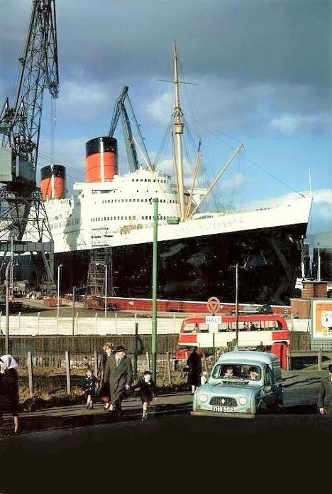 The 83,600-ton Queen Elizabeth in dry dock at the Firth of Forth Graving Dock, Scotland, December 1965, during her $4 million refit. William H. Miller Collection