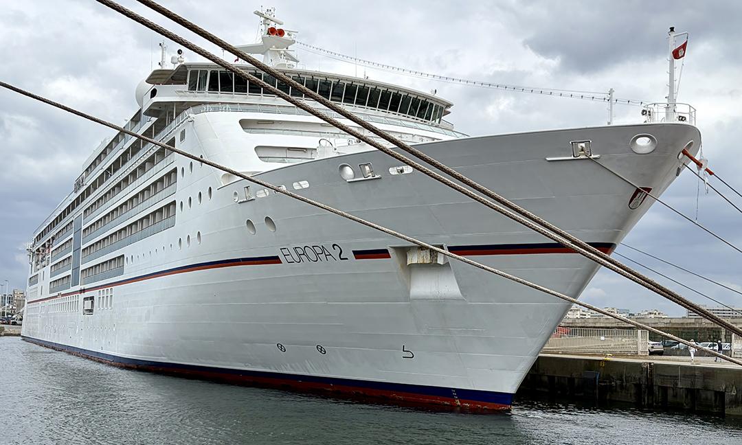 Europa 2 sits at Lisbon’s Santa Apolonia Cruise Terminal, her brilliant white exterior accented only by a single stripe in the colors of the German flag. Photo: Judi Cuervo