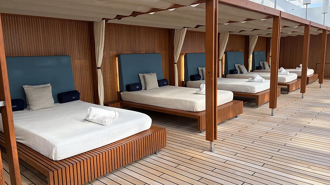 Canopied daybeds line the pool deck aboard Hapag-Lloyd Cruises’ Europa 2. Photo: Judi Cuervo