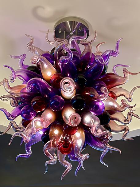 Murano glass ceiling fixtures add a dramatic focal point aboard Europa 2. Photo: Judi Cuervo
