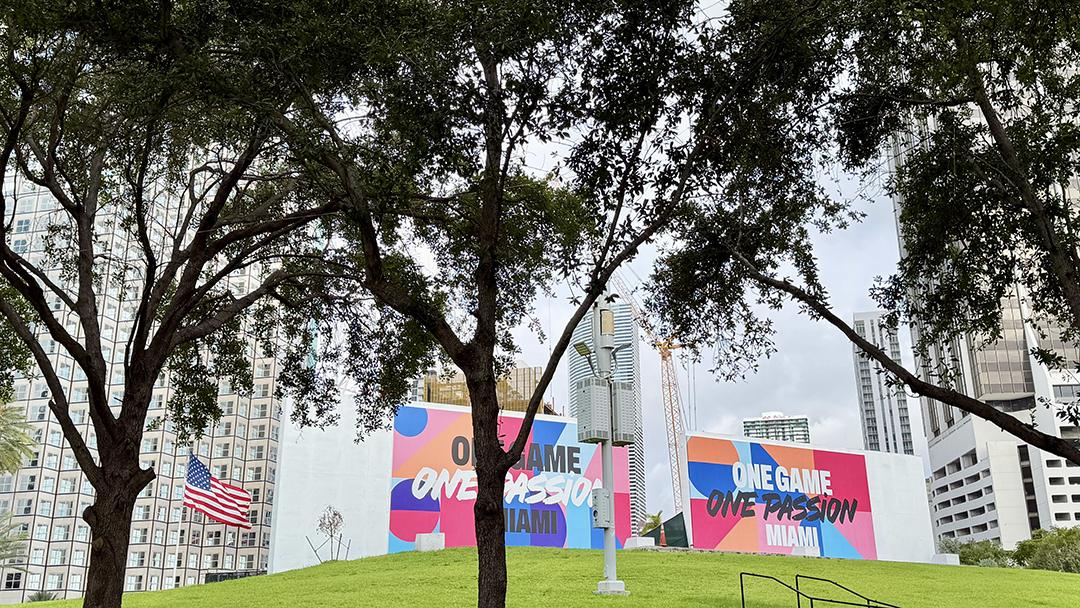 A FIFA World Cup installation featuring the tournament’s “One Game, One Passion” slogan stands on the FIFA Fan Festival grounds at Bayfront Park in downtown Miami. Credit: H. Liu.