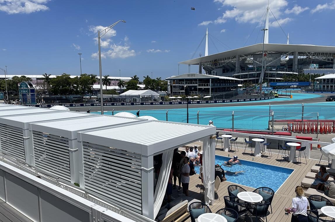 The Marina Deck features private cabanas and a dipping pool with views of Turns 5 through 9 at the Miami Grand Prix. Photo: Ming Tappin.
