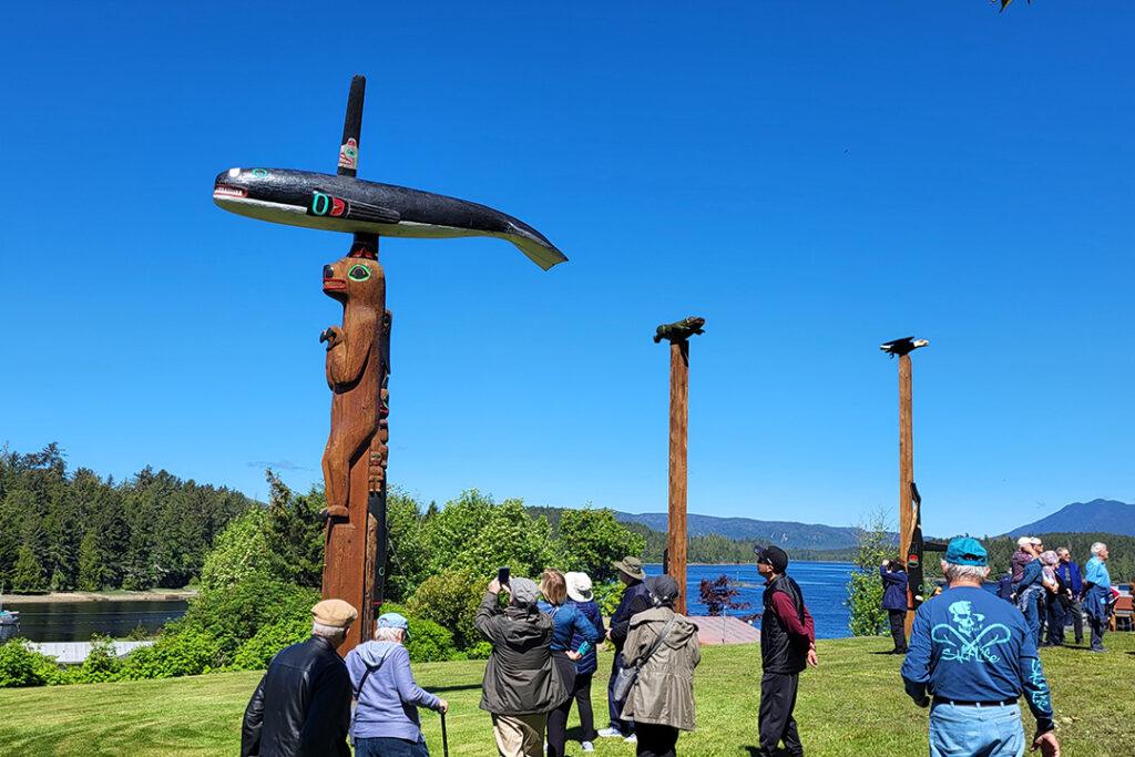 Visitors explore Klawock Totem Park on Prince of Wales Island. Courtesy of Huna Totem Corporation.