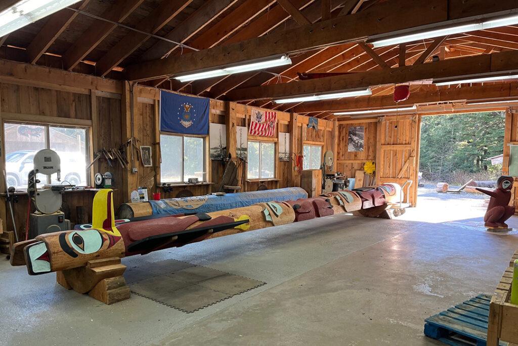 A hand-carved totem pole rests inside a carving shed in Klawock, Alaska. Photography by Richard Dalton III and courtesy of Huna Totem Corporation.