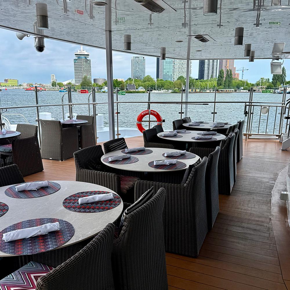 Outdoor seating at the Riverside Café provides a relaxed place to watch the scenery pass by. Photo by Monte Mathews.
