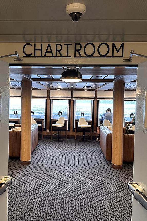 The Chart Room aboard American Encore offers forward-facing views and a quiet space for passengers to follow the journey. Photo: Gerry Barker