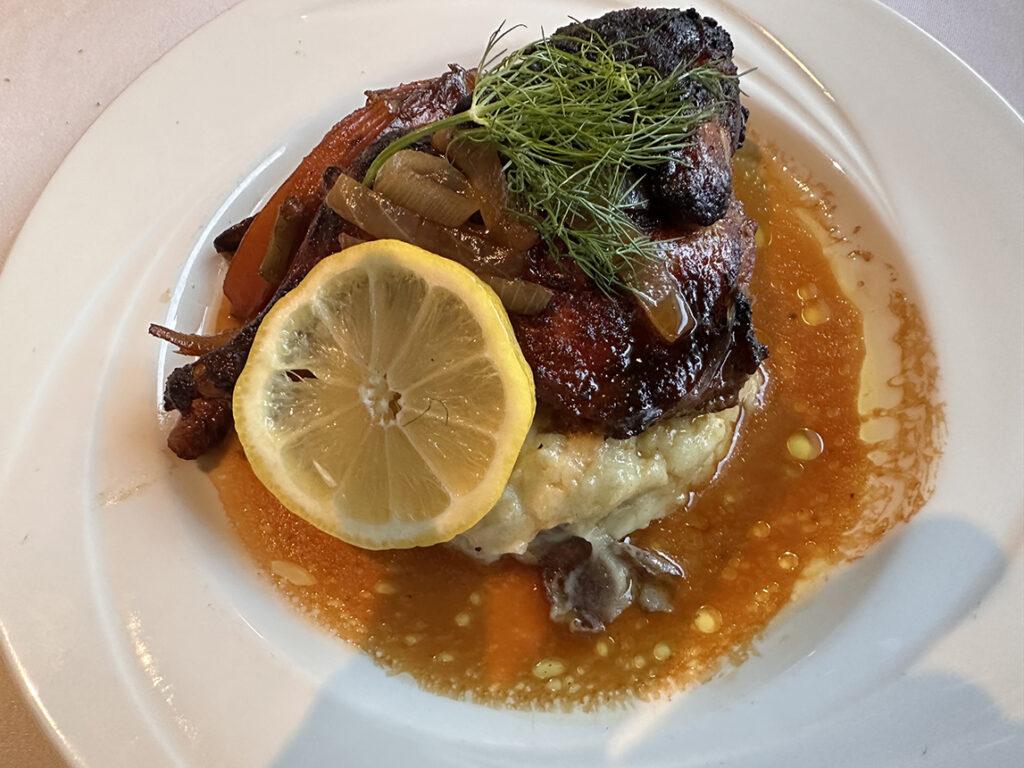 Roasted Cornish hen with sweet onion jus, butternut squash purée, sautéed fennel and Swiss chard aboard American Encore. Photo: Gerry Barker
