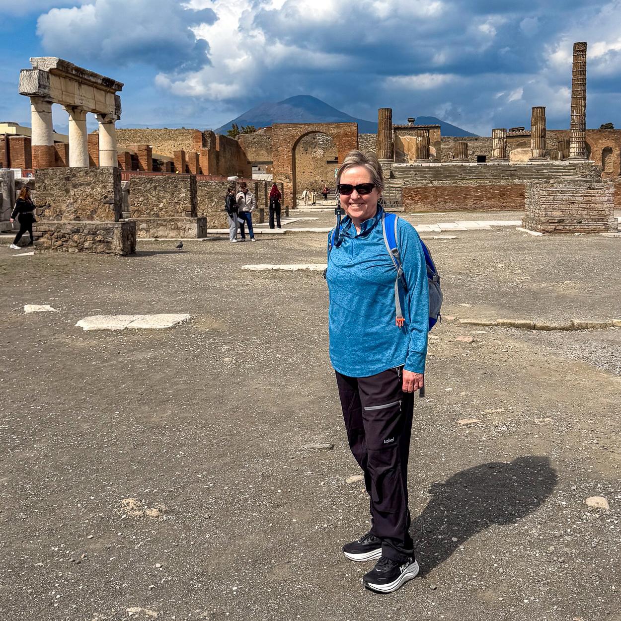 Gwen Pratesi visits the ruins of Pompeii, with Mount Vesuvius in the background. Photo: Gwen Pratesi.