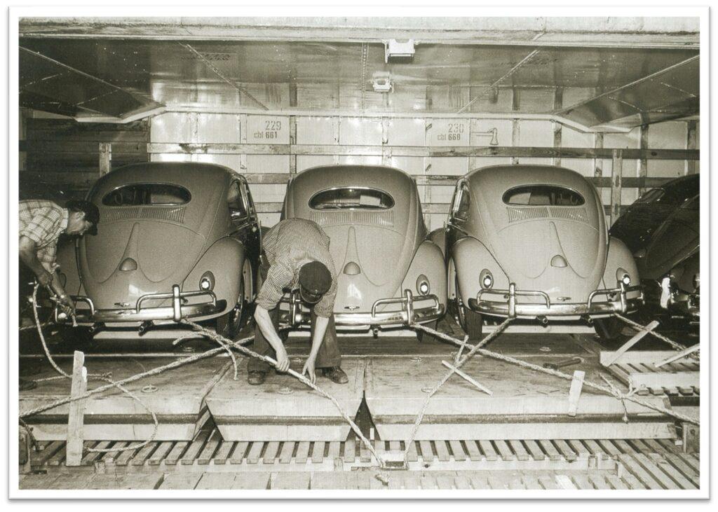 Workers release the transport lashings from the first Volkswagens to arrive in the United States, at Hoboken in 1949. From the William H. Miller Collection.
