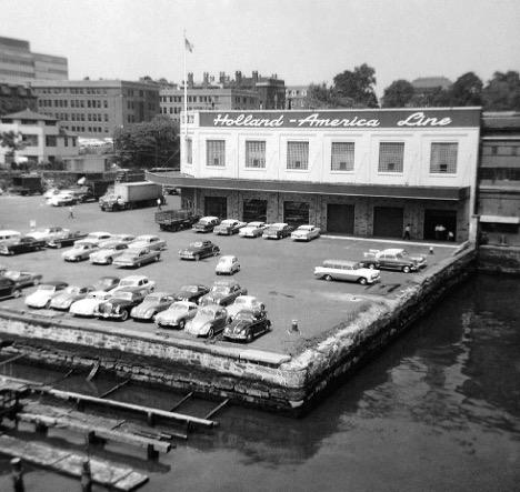 Holland America Line’s Fifth Street Pier in Hoboken in 1960, with parked cars filling the waterfront terminal apron. From the William H. Miller Collection.