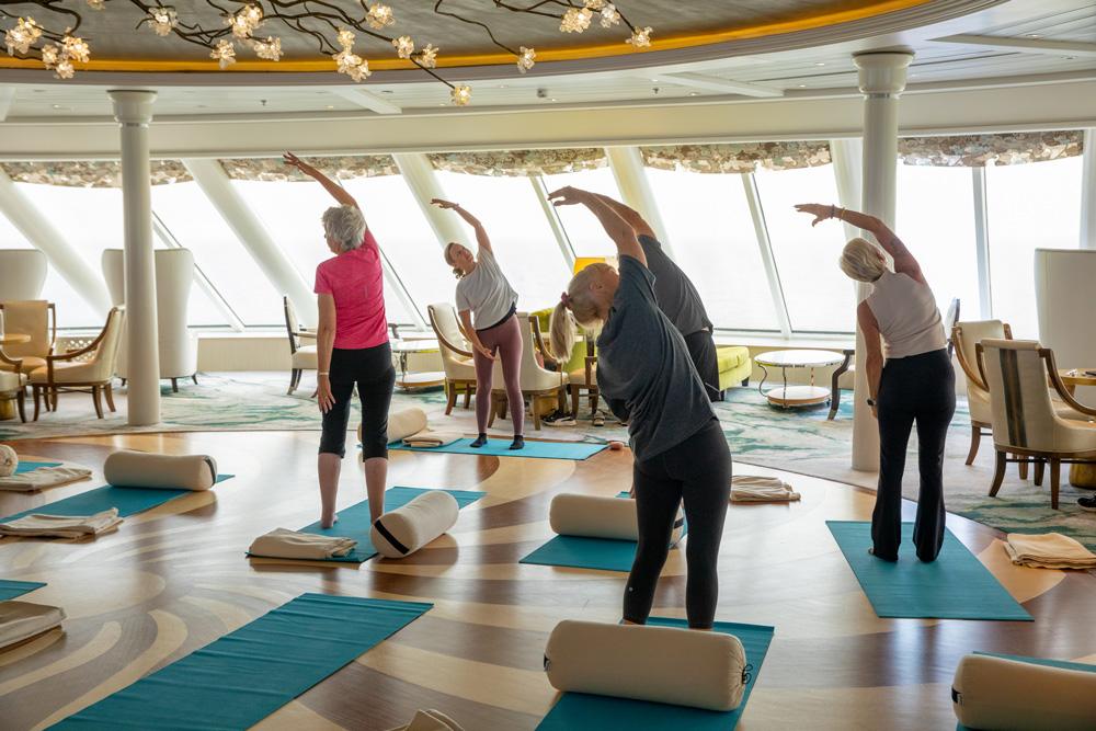 Passengers take part in a yoga session aboard a Crystal cruise ship. Credit: Crystal Cruises