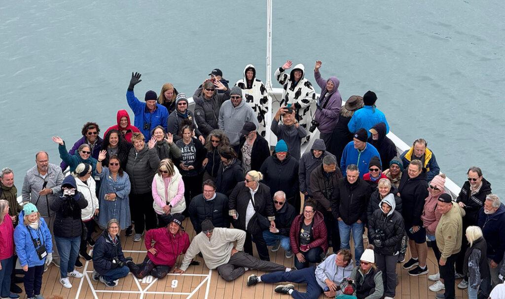 Residents gather on the bow of Villa Vie Odyssey in Alaskan waters. Photo: Villa Vie Residences