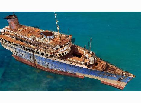 The rusting forward section of the American Star remains stranded in shallow water off the Canary Islands. Courtesy of the William H. Miller Collection.