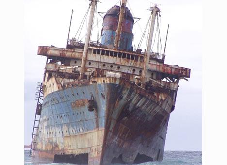 The corroded bow of the American Star rises from the water off the Canary Islands, showing the severe deterioration of the stranded wreck. Courtesy of the William H. Miller Collection.