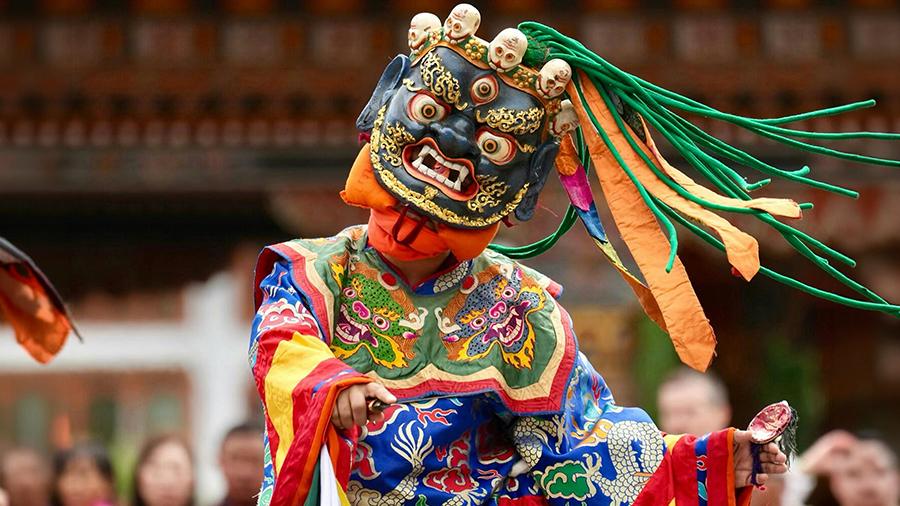 A traditional masked dancer performs in Bhutan, one of five destinations featured in Passage Journeys’ inaugural 2027 program. Photo courtesy of Passage Journeys.