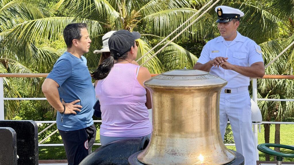 A Peruvian Navy crew member speaks with visitors aboard B.A.P. Unión during the tall ship's public opening in Miami. Photo: H. Liu
