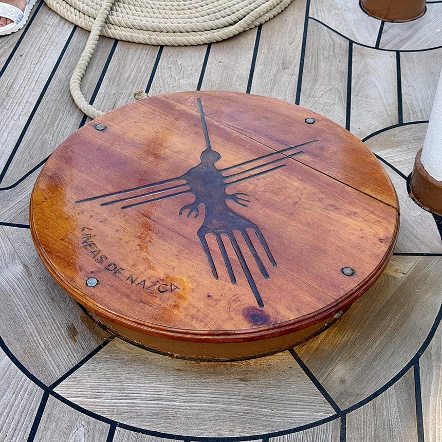 The famous hummingbird geoglyph from Peru’s Nazca Lines is depicted on a wooden deck cover aboard B.A.P. Unión. Photo: H. Liu