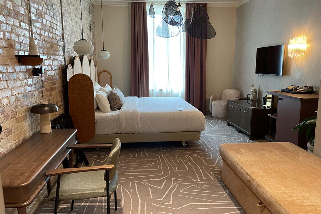 Rooms have contemporary décor, and the exposed brick wall adds a nice touch. Photo: Ming Tappin.