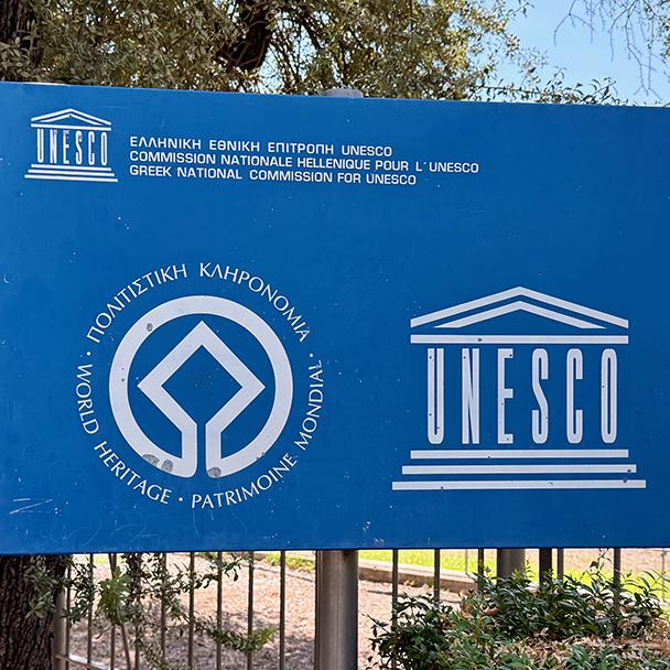 A UNESCO World Heritage sign marks the archaeological site of Olympia in Greece. Credit: Monte Mathews