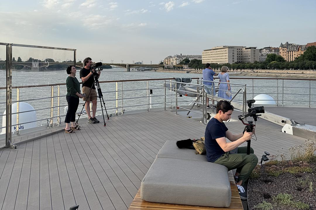 Lynn Elmhirst and the World’s Greatest Cruises film crew capture a sunset departure from Budapest aboard Riverside Mozart. Photo: H. Liu.