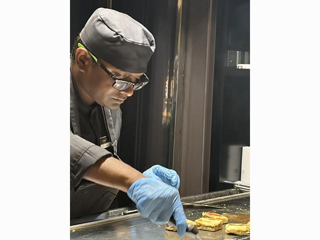 A chef prepares dishes at Night Market, Scenic Eclipse II’s intimate eight-seat dining experience. Photo: Judi Cuervo