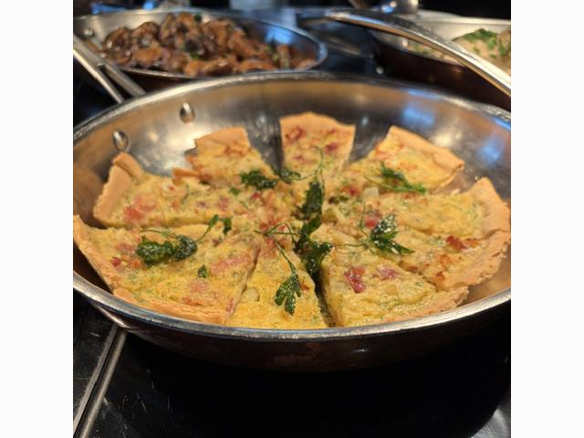 Quiche is served during The Yacht Club’s France-themed buffet lunch as Scenic Eclipse II calls at Honfleur. Photo: Judi Cuervo